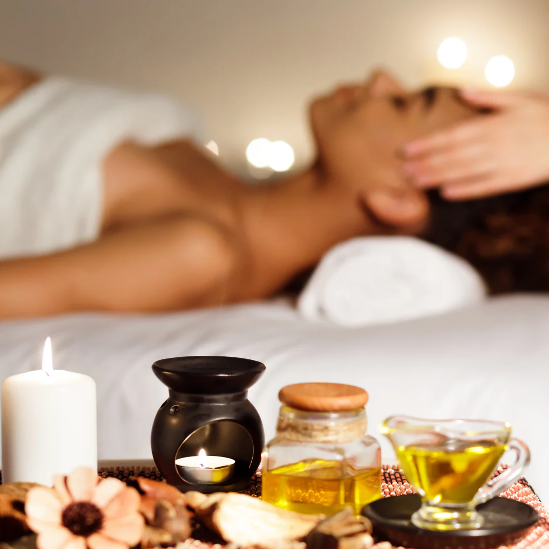 Spa products and a candle set out for a relaxing home spa session in Hyderabad